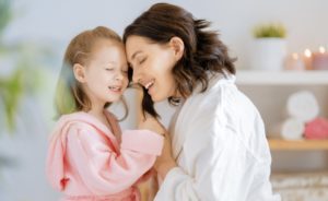Mother and his girl smiling image