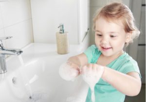 A girl washing his hand